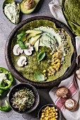 Green spinach matcha tortilla with vegan ingredients for filling