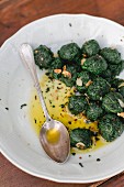 Spinach dumplings in olive oil