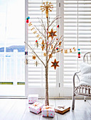 Christmas decorated branch with glitter color, including wrapped gifts