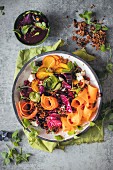 Salad with vegetable strips and a beetroot and pomegranate dressing