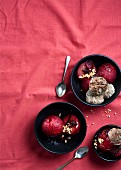 Plums poached in red wine and ginger syrup with nut ice cream