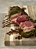 Grilled lamb chops with a herb crust, sliced