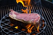 A beef steak (Cote de Boeuf) on a charcoal grill