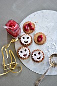Smiley cookies with cranberry jam