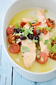 Salmon fillets with tomatoes, olives and spring onions
