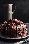 Chocolate cake with currant jam and caramelised pecans