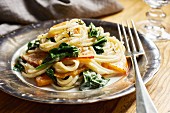 Spaghetti with pumpkin and spinach in a cream sauce