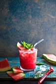 Watermelon slushie with fresh mint in a glass