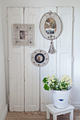 Picture frames made from corrugated cardboard on old window shutter