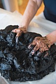 A peat mud pack for the hands at the Prinz-Luitpold-Bad spa hotel in Bad Hindelang in the Allgäu region of Germany
