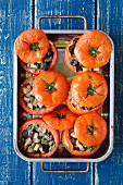 Baked tomatoes stuffed with eggplant, capers and basil