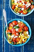 Tagliatelle with cherry tomatoes, basil and goats cheese