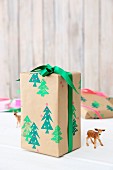 Gift wrapped in paper printed with Christmas trees