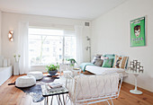 White furniture and wooden floor in bright living room