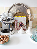 Every day still-life arrangement with coffee machine and trays