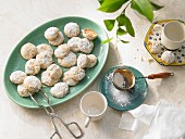 Lemon cookies with icing sugar on an oval plate