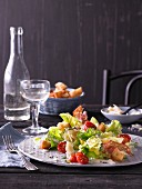 Caesar salad with tomatoes and pancetta