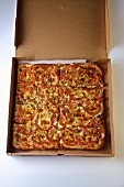 Tomato pizza in an open delivery box