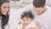 Young boy playing with parents