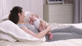 Baby lying on mother's chest