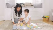 Mother and son playing with blocks