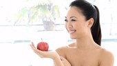 Woman holding apple