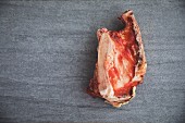 A raw organic meat bone (seen from above)