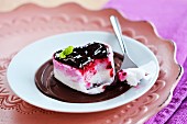 A heart shaped dessert with berry jam and chocolate cream
