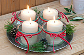 Simple Advent wreath made of preserving jars as a candle holder