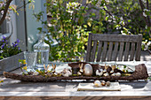 Unusual Easter table decoration with golden easter bunnies