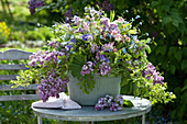 Spring arrangement from Syringa, Aquilegia, Myosotis