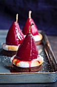 Desserts with red wine infused pears and meringue