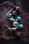 Turquoise and silver Christmas tree baubles and pale blue ribbon