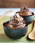 Cupcakes topped with chocolate and caramel bars