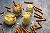 Pretzel sticks with mustards for dipping