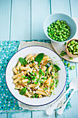 Pasta with grilled courgettes, fava beans, peas, crispy bacon and mint