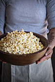 Grilled popcorn in a wooden bowl