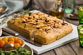 Authentic Italian focaccia made with spelt flour, studded with rosemary and perfect for sharing