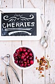 Stoned cherries with a slate sign