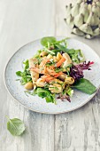 Artichoke salad with smoked salmon and olives
