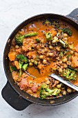 Chickpea and butternut squash curry in a cooking pot