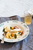 Roasted pumpkin and ricotta ravioli with sage, butter and parmesan cheese
