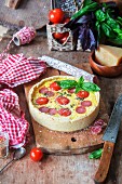 Cheese pie with tomatoes and salami