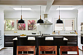 View over the back of a chair to the center block in the open kitchen