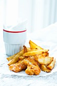 Fried chicken goujons and potato wedges