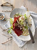Bresaola with pear and nut tartar on rocket (Switzerland)