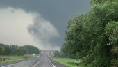 Tornadoes crossing a road