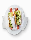 Hot dogs with gherkins and onions