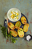 Oven-baked potatoes with chopped eggs and wild herbs