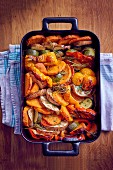Roasted sweet potatoes and vegetables in an oven dish